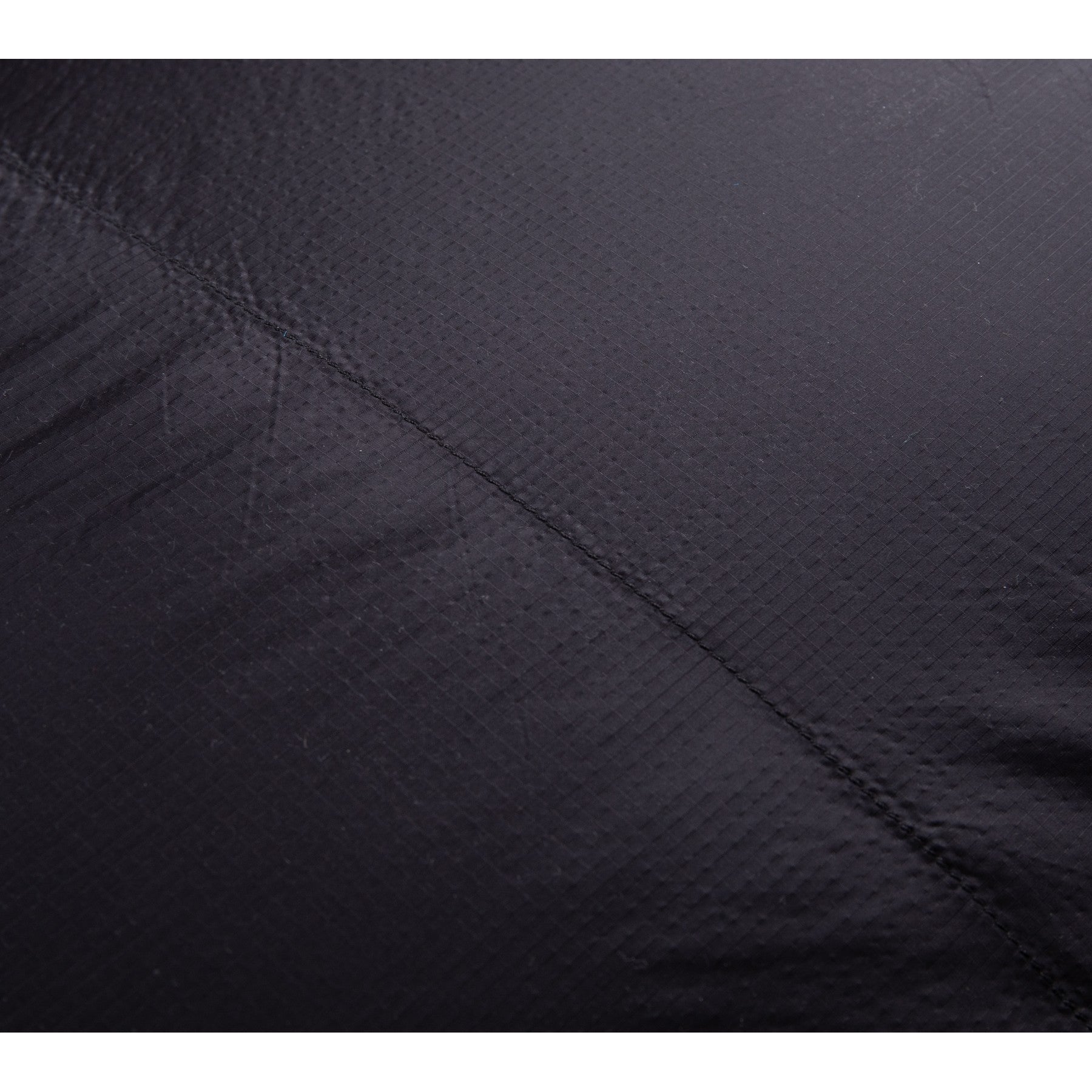 Close-up of durable ripstop nylon fabric on a QEZER mummy sleeping bag