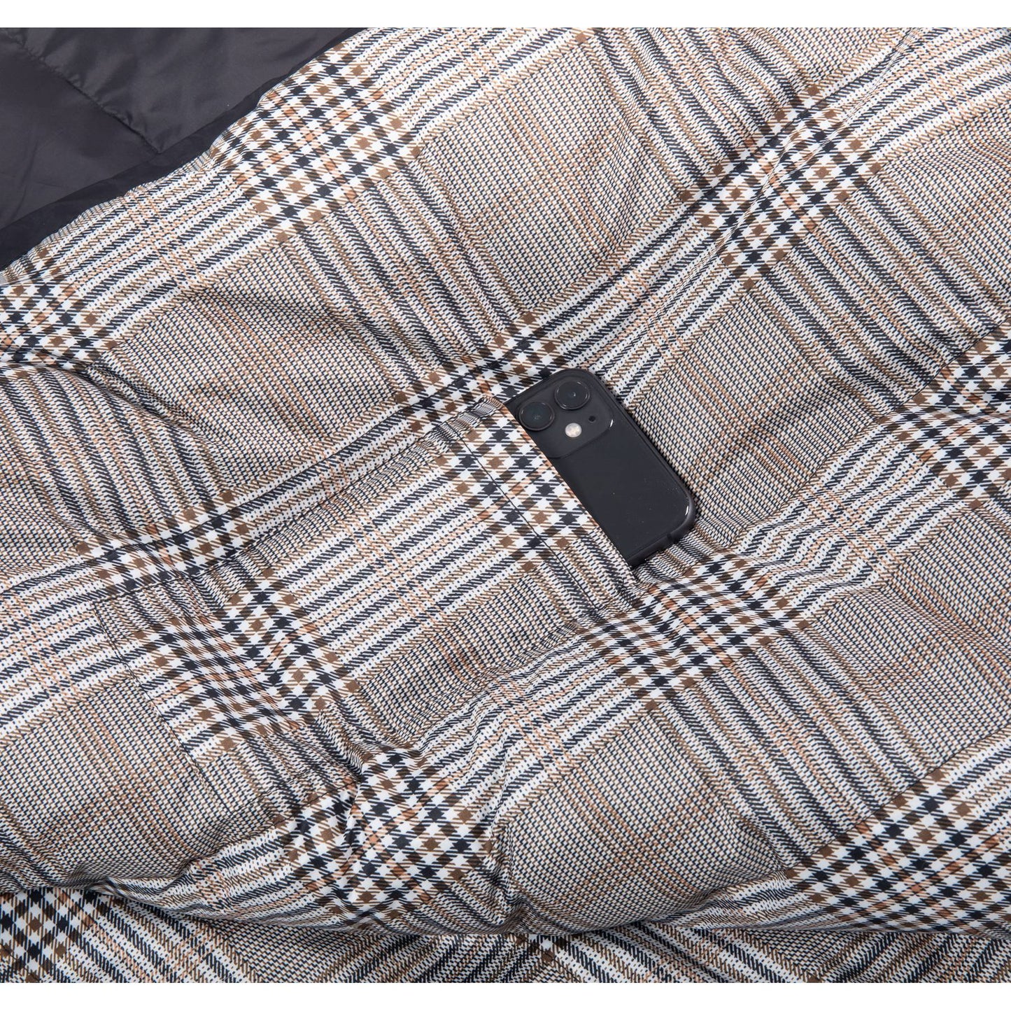 Inner storage pocket holding a smartphone inside QEZER plaid sleeping bag