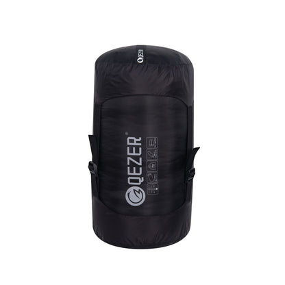 QEZER mummy down sleeping bag packed in a black compression sack