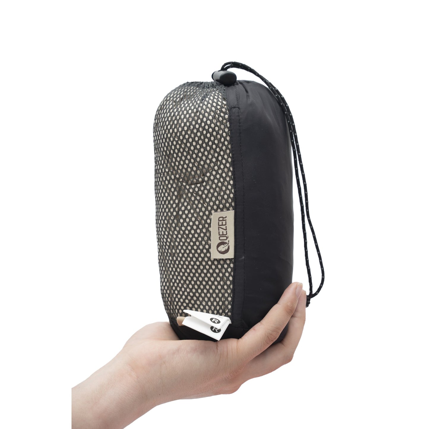 QEZER ultralight sleeping bag liner packed in a compact mesh storage pouch