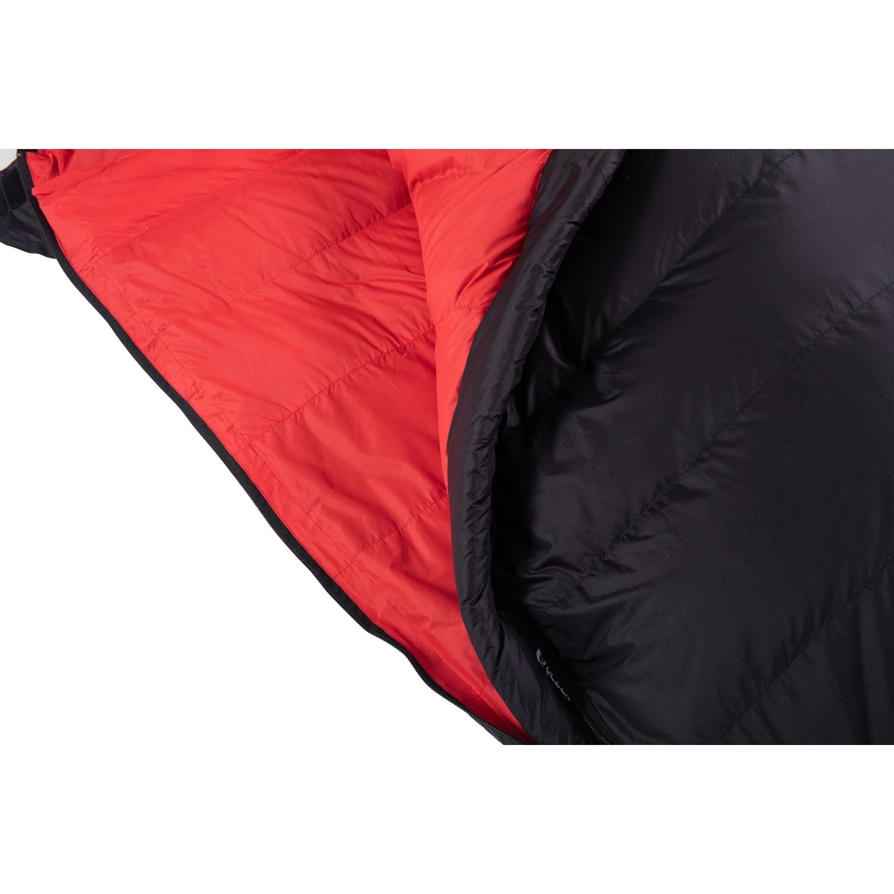 Red lining and black shell seam detail on a QEZER rectangular sleeping bag