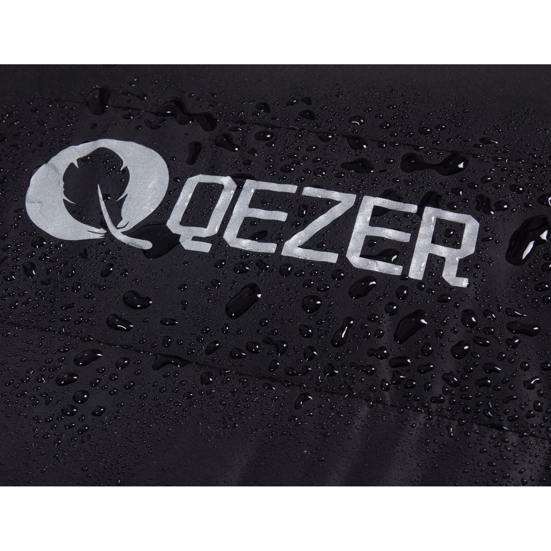 Water droplets beading on the black shell and QEZER logo