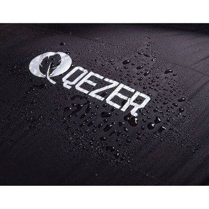 Water droplets beading on the black shell and QEZER logo of a mummy sleeping bag