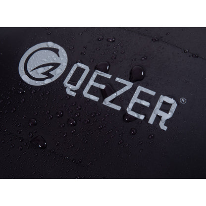 Water droplets on the black nylon shell and QEZER logo of a mummy down sleeping bag